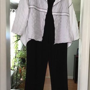 Black palazzo pants with white jacket.
